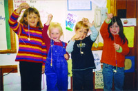 Students show off their string of beads
